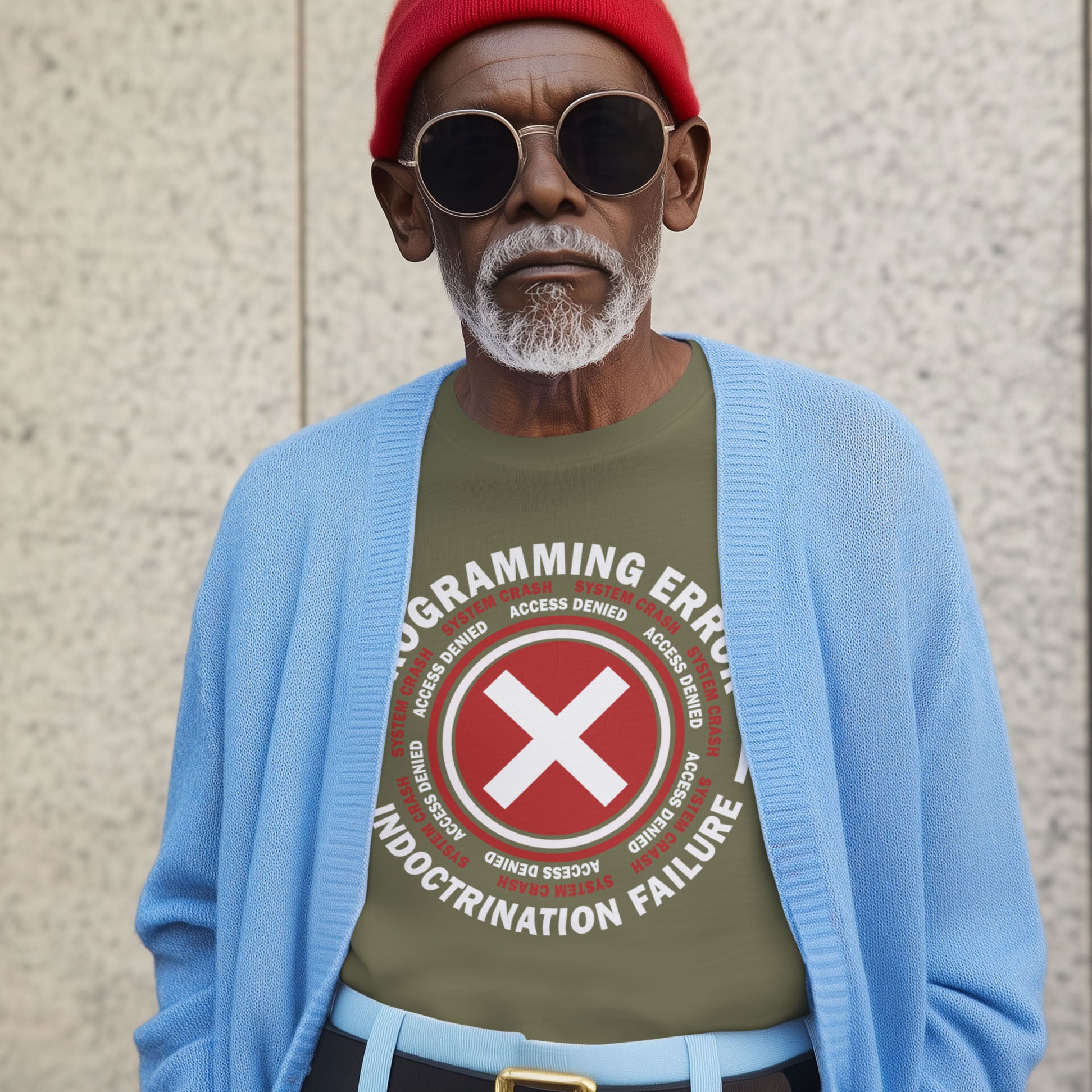 Man wearing a green t-shirt with a red and white graphic design, blue cardigan, and red beanie against a beige wall. A true conspiracy theory t-shirt. If you don't think from the same hive mind as those around you and you missed out on some media brainwashing you'll love this sarcastic and satirical view of indoctrination and human programming. Made from 100% organic ring-spun cotton, this satirical conspiracy theory t-shirt is unisex, high-quality, super comfy, and best of all, eco-friendly.