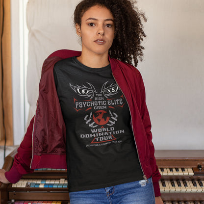 Person wearing a black t-shirt with graphic design and text, standing in front of vintage keyboard instruments. This conspiracy theory t shirt design combines a belief in an elite rich cabal with a rock band tour poster style. Show your disgust in greed and power hunger with this very satirical tour design. If the rich elite started a band this is what it would look like. Made from 100% organic ring-spun cotton, this conspiracy theorist t shirt is unisex, high-quality, super comfy, and best of all, eco-frie