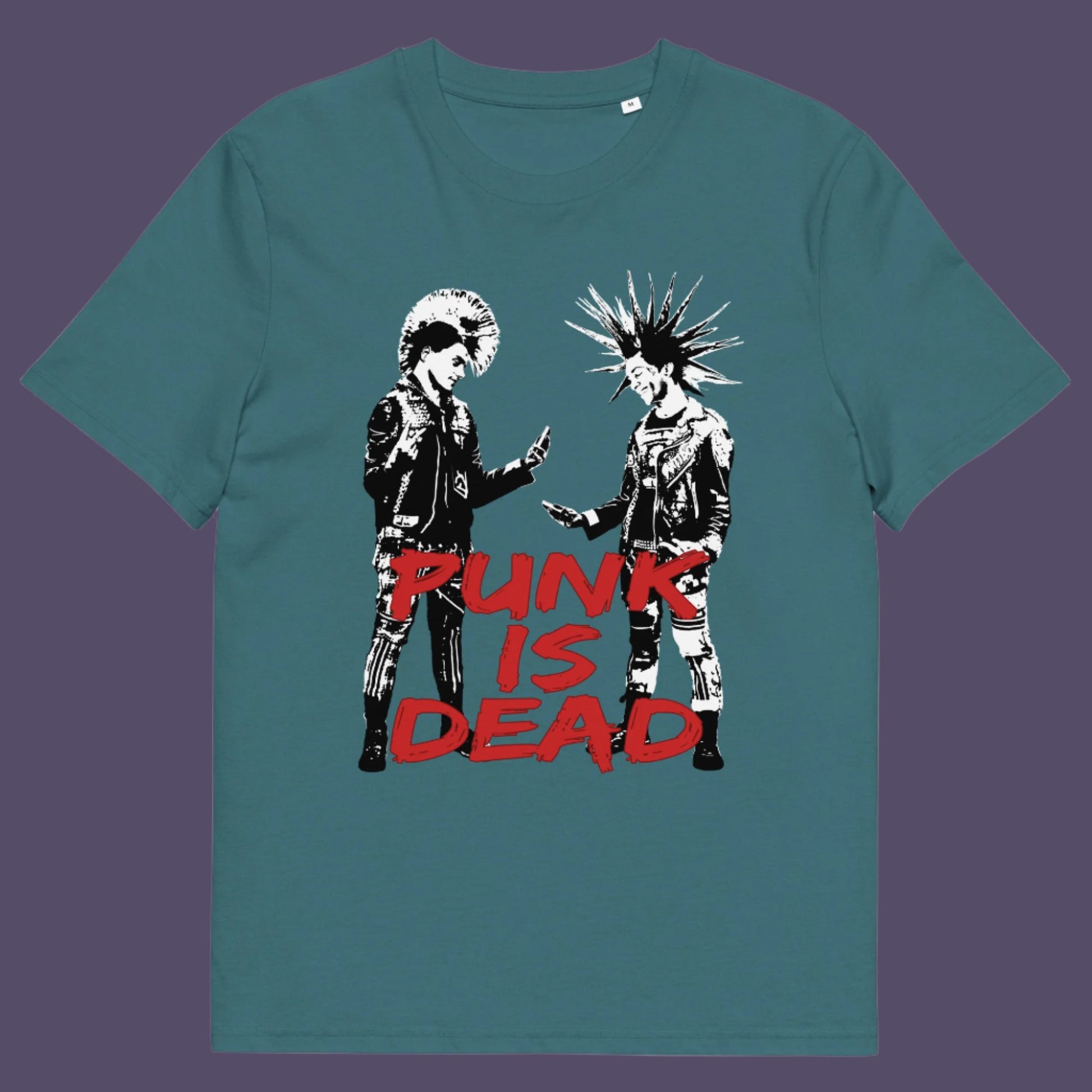 Light blue t-shirt. This controversial design questions the slogan, 'Punks not dead' by suggesting that our ever increasing reliance on mobile phones is a level of conformity and acceptance of enforced technological advancements. This is not what you expect from the free world and punks on smart phones just doesn't look right. Made from 100% organic ring-spun cotton, this counterculture t-shirt is unisex, high-quality, super comfy, and best of all, eco-friendly.