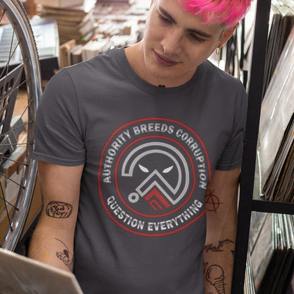 Person wearing a t-shirt standing in a store. A question everything t shirt for everyday defiance or leading the next protest rally. Help create social awareness of the dark side of human nature, how power corrupts and authority is abused. To be worn with pride in support of a world where authority should be answerable to the people who put them there. Made from 100% organic ring-spun cotton, this broken society t shirt is unisex, high quality, super comfy, and best of all, eco-friendly.