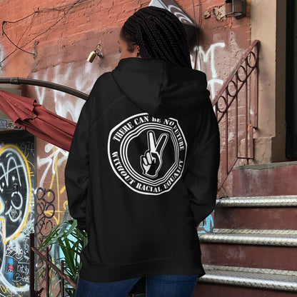 Person wearing a black hoodie with a white graphic design on the back, standing in an urban setting with graffiti. An anti-racism hoodie for Peace without prejudice There can be no future without racial equality. Comfortable and practical. It's extra soft and has a convenient front pouch pocket. Made from organic cotton and recycled polyester, this anti racism hoodie is a great eco-friendly choice.
