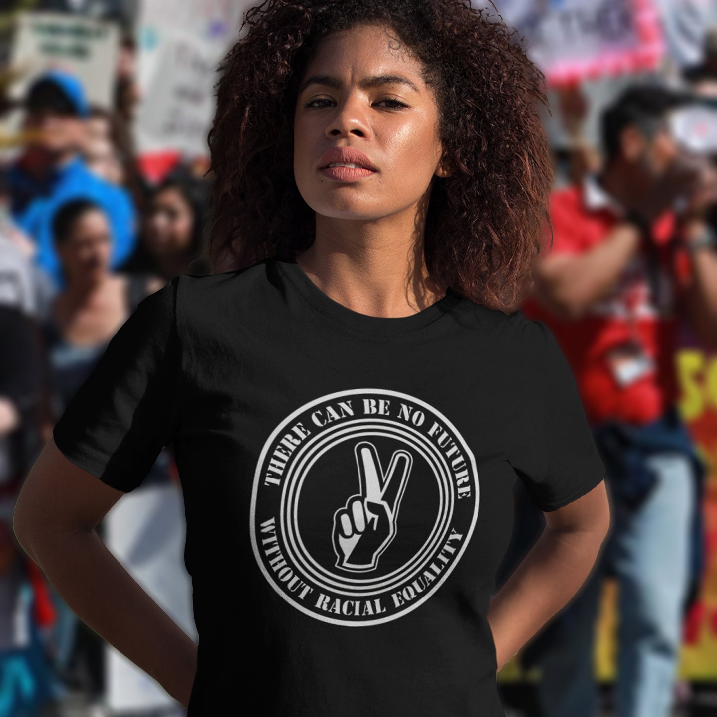 Person wearing a black t-shirt with a peace sign and text in a crowd. An anti-racism t-shirt denouncing prejudice. Peace without prejudice. There can be no future without racial equality. Made from 100% organic ring-spun cotton, this social awareness anti racism t-shirt is unisex, high-quality, super comfy, and best of all, eco-friendly.