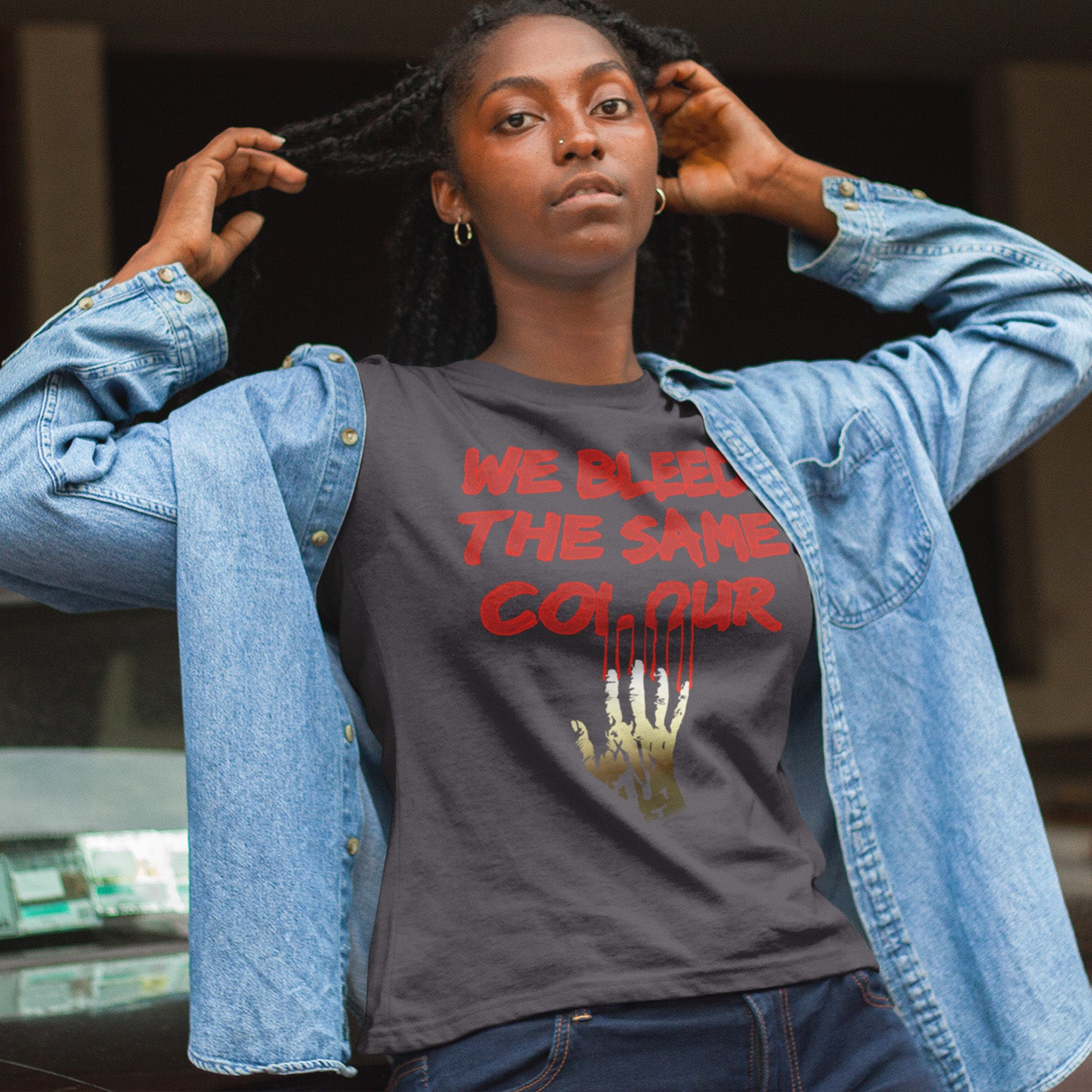 Person wearing a t-shirt with a message and denim jacket. This anti racism t-shirt design highlights how shallow racism is. show you stand against prejudice with this street style urban art on apparel. Made from 100% organic ring-spun cotton, this social awareness anti racism t shirt is unisex, high-quality, super comfy, and best of all, eco-friendly.
