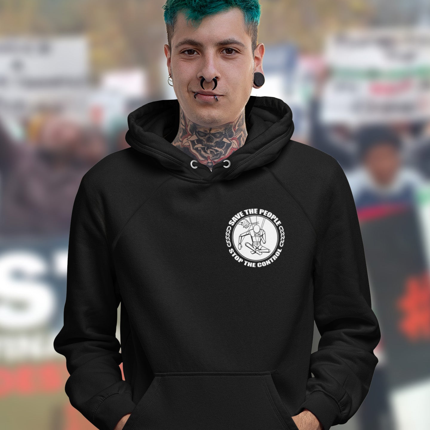 Person wearing a black hoodie with a white logo on a blurred background. This political hoodie carries an anti-dictatorship message and encourages independent thought. A unique design promoting freedom of choice and a less controlling government. Comfortable and practical. It's extra soft and has a convenient front pouch pocket. Made from organic cotton and recycled polyester, this political hoodie is a great eco-friendly choice.