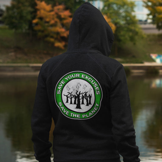 Person wearing a black hoodie with a green and white logo and text, standing by a body of water. A save the planet t-shirt that promotes social awareness of environmental issues. It's time to stop making poor excuses for why we haven't got around to saving our planet yet. Comfortable and practical. It's extra soft and has a convenient front pouch pocket. Made from organic cotton and recycled polyester, this environmental awareness hoodie is a great eco-friendly choice.