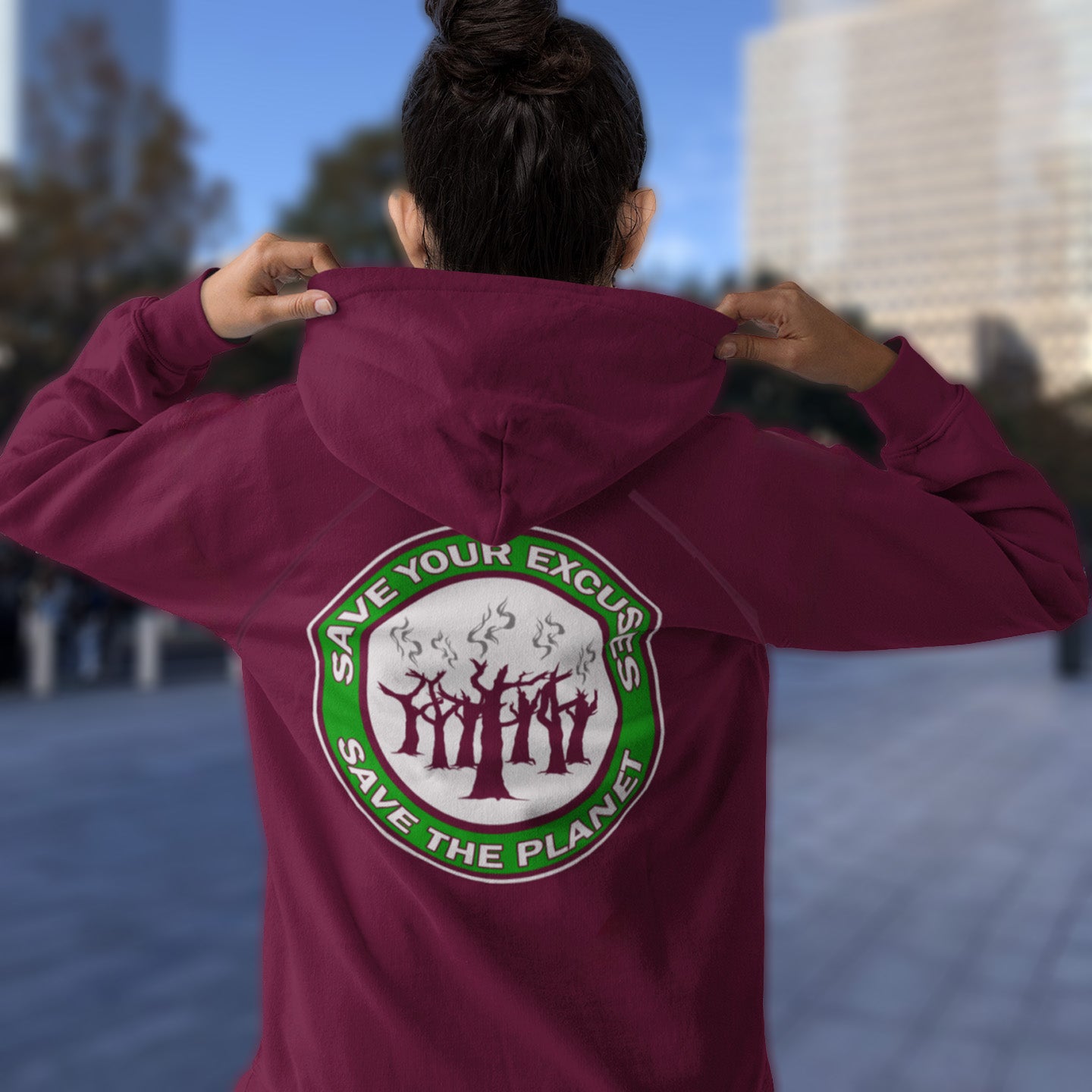 Person wearing a burgundy hoodie with a motivational message on the back, standing outdoors. A save the planet t-shirt that promotes social awareness of environmental issues. It's time to stop making poor excuses for why we haven't got around to saving our planet yet. Comfortable and practical. It's extra soft and has a convenient front pouch pocket. Made from organic cotton and recycled polyester, this environmental awareness hoodie is a great eco-friendly choice.