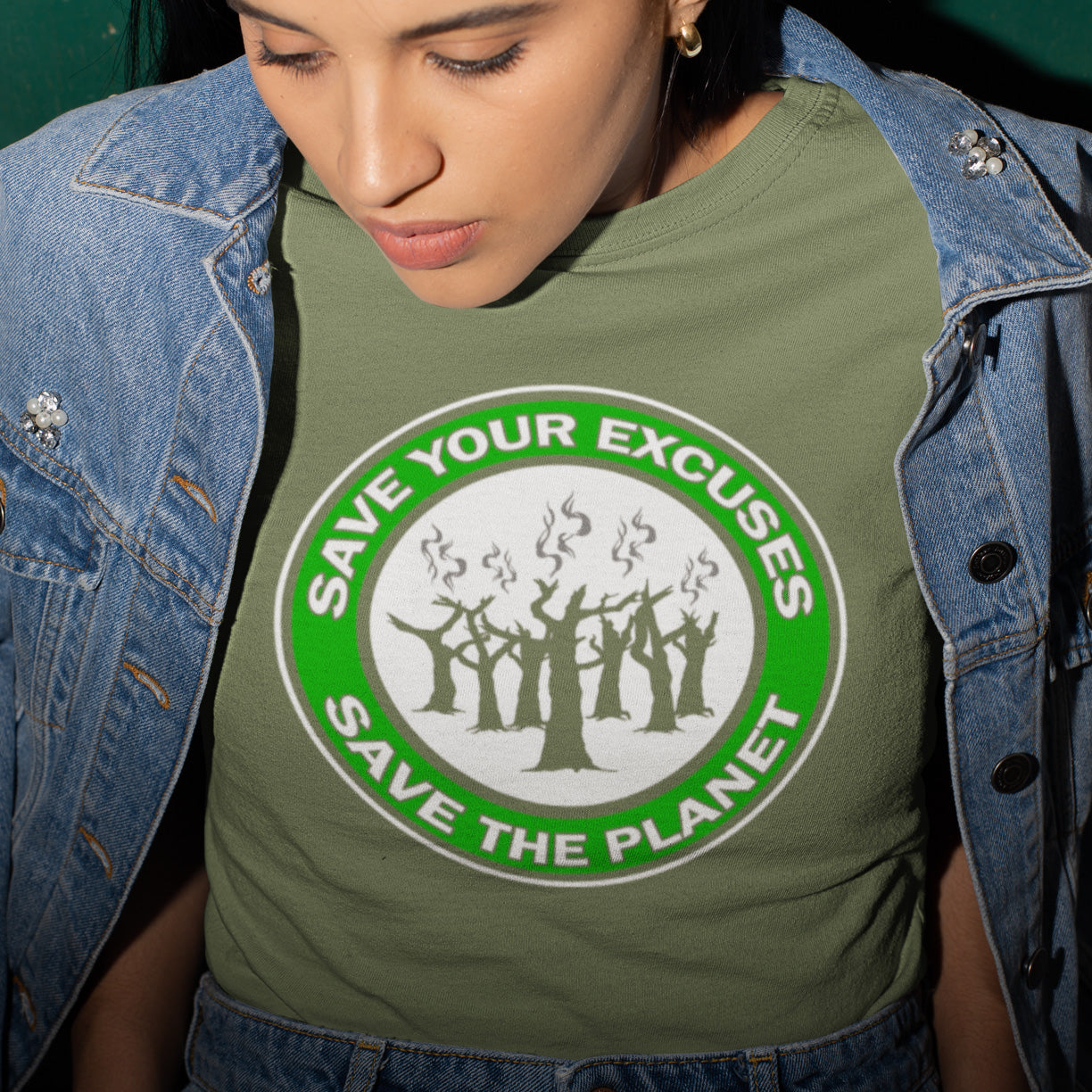 Person wearing a khaki t-shirt with a message about saving the planet. A 'save the planet' t-shirt that promotes social awareness of environmental issues. It's time to stop making poor excuses for why our governments haven't got around to saving our planet yet. Made from 100% organic ring-spun cotton, this environmental awareness t-shirt is unisex, high-quality, super comfy, and best of all, eco-friendly.