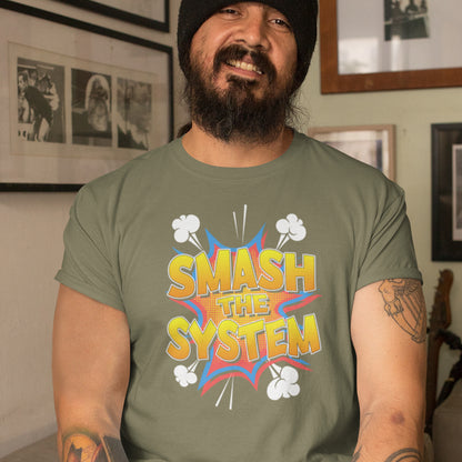 Man wearing a green t-shirt with 'SMASH THE SYSTEM' graphic design indoors. A funny political t-shirt in a comic book style. A unique design for all you politically impatient comic book fans. Made from 100% organic ring-spun cotton, this humorous political t-shirt is unisex, high-quality, super comfy, and best of all, eco-friendly.