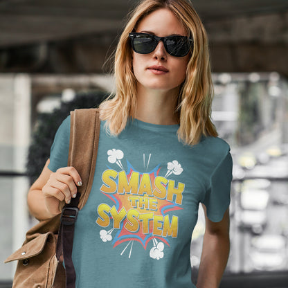Woman wearing a blue t-shirt with 'SMASH THE SYSTEM' text and design. A funny political t-shirt in a comic book style. A unique design for all you politically impatient comic book fans. Made from 100% organic ring-spun cotton, this humorous political t-shirt is unisex, high-quality, super comfy, and best of all, eco-friendly.