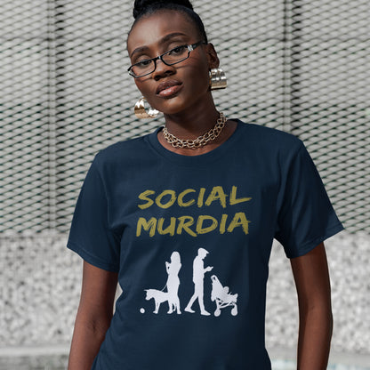 Person wearing a navy blue t-shirt with 'SOCIAL MURDIA' text. An anti-social media t-shirt arguing against the abuse of social media and mobile phones. The main aim of social media is to connect people, but it doesn't look like that from street level. This anti-mobile phone design suggests society is actually being murdered by media on mobiles. Made from 100% organic ring-spun cotton, this social awareness t-shirt is unisex, high-quality, super comfy, and best of all, eco-friendly.