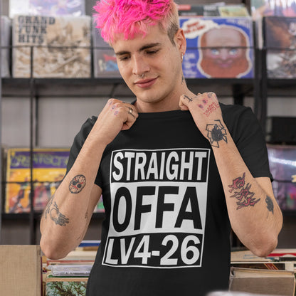 Person wearing a black t-shirt with 'STRAIGHT OFFA LV4-26' text in a record store. This 'Alien' the movie t-shirt is subtle and loud at the same time' A design for fans of N.W.A and Alien movie lovers. Made from 100% organic ring-spun cotton, this witty sci-fi t-shirt is unisex, high-quality, super comfy, and best of all, eco-friendly.