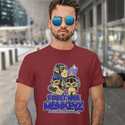 Man standing in the street wearing a burgundy 'street wise monkeyz' t-shit. A street art graffiti t-shirt design depicting a modern slant on the three wise monkeys. It's time to be street wise. Hear and see everything and have your say. The time for ignorance is over. Made from 100% organic ring-spun cotton, this street art t-shirt is unisex, high-quality, super comfy, and best of all, eco-friendly.