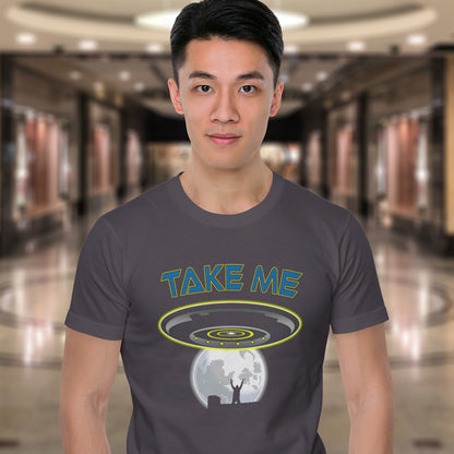 Person wearing a t-shirt with 'TAKE ME' graphic design in a mall setting. This funny alien abduction t-shirt is a must for everyone who feels they have you had enough of this planet or, more to the point, the human race. Do you sometimes think you would be better off being abducted ? Made from 100% organic ring-spun cotton, this funny sci fi t-shirt is unisex, high-quality, super comfy, and best of all, eco-friendly.