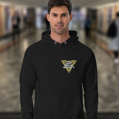 Man wearing a black hoodie with a anti social society logo in an indoor setting. This anti-social clothing design gives you an oxymoron to ponder, the more and more you don't want to be a member, the more you become one. A satirical counterculture dig at modern society. Comfortable and practical. It's extra soft and has a convenient front pouch pocket. Made from organic cotton and recycled polyester, this social awareness hoodie is a great eco-friendly choice.