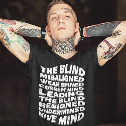 Man wearing a black t-shirt with text and tattoos on arms and neck. An anti government t shirt suggesting that it's not just a case of the blind leading the blind anymore. It's now a lot more complicated. Show your social awareness of a dysfunctional society with this political slogan design. Made from 100% organic ring-spun cotton, this dystopian t shirt design is unisex, high-quality, super comfy, and best of all, eco-friendly.