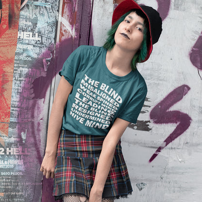 Person wearing a green t-shirt with text and a plaid skirt against a graffiti-covered wall. An anti government t shirt suggesting that it's not just a case of the blind leading the blind anymore. It's now a lot more complicated. Show your social awareness of a dysfunctional society with this political slogan design. Made from 100% organic ring-spun cotton, this dystopian t shirt design is unisex, high-quality, super comfy, and best of all, eco-friendly.