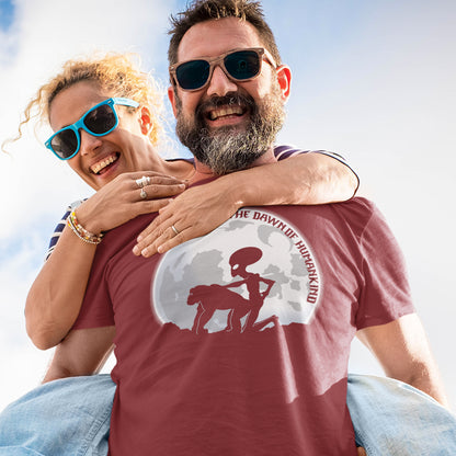 Man carrying a woman on his back with an alien t shirt on .A hilarious alien conspiracy theory t shirt depicting an one alternative reason for the evolution of humankind on this planet. One of many possibilities as to our origins and why there is such a great distance between us and the rest of the animal kingdom. Made from 100% organic ring-spun cotton, this conspiracy theory t shirt is unisex, high-quality, super comfy, and best of all, eco-friendly.
