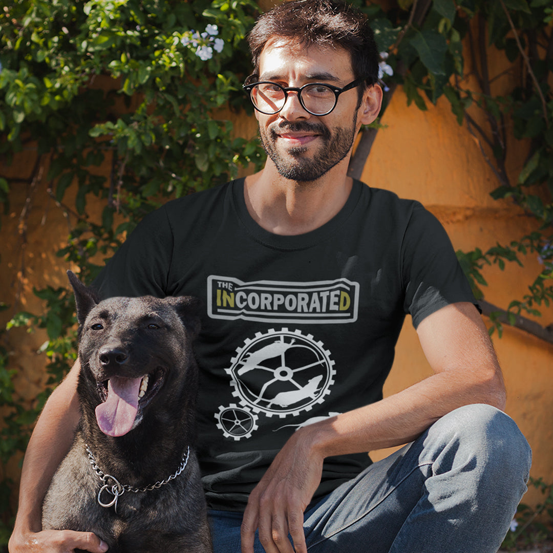 Man dressing a black t shirt with a dog. This non conformist design questions the effects of a corporate run society in the form of a spoof rock band t shirt. Have we just created a corporate cult to follow ? A satirical and alternative view of the modern rat race. Made from 100% organic ring-spun cotton, this counter culture t shirt is unisex, high-quality, super comfy, and best of all, eco-friendly.