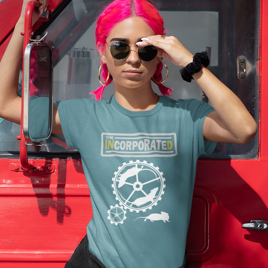 Person with pink hair wearing a stargazer t-shirt with a logo, standing next to a red vehicle. This non conformist design questions the effects of a corporate run society in the form of a spoof rock band t shirt. Have we just created a corporate cult to follow ? A satirical and alternative view of the modern rat race. Made from 100% organic ring-spun cotton, this counter culture t shirt is unisex, high-quality, super comfy, and best of all, eco-friendly.