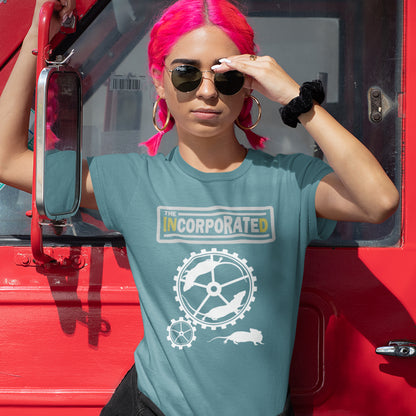 Person with pink hair wearing a stargazer t-shirt with a logo, standing next to a red vehicle. This non conformist design questions the effects of a corporate run society in the form of a spoof rock band t shirt. Have we just created a corporate cult to follow ? A satirical and alternative view of the modern rat race. Made from 100% organic ring-spun cotton, this counter culture t shirt is unisex, high-quality, super comfy, and best of all, eco-friendly.