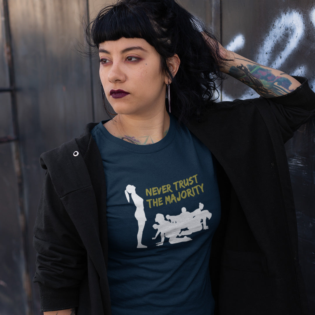 Person wearing a t-shirt standing against a dark background. This self worth t shirt promotes independent thought. In this era of manipulation, indoctrination, misinformation and gaslighting, you have to think twice before believing what the majority of people think. Promote independent thinking and diversity with this satirical 'think outside the box' design. Made from 100% organic ring-spun cotton, this non conformist t shirt is unisex, high quality, super comfy, and best of all, eco-friendly.
