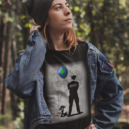 Person wearing a t-shirt with an artistic design of a person holding a globe, standing in a forest. A Banksy style graffiti t-shirt with a political message suggesting that we possible left the world in the wrong hands while being distracted. Save the planet by giving it back to the children. Made from 100% organic ring-spun cotton, this graffiti stencil art t-shirt is unisex, high-quality, super comfy, and best of all, eco-friendly.