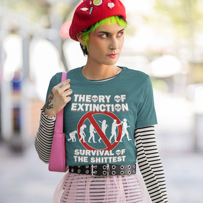 Person wearing a t-shirt with 'Theory of Extinction' design outdoors. This broken society t shirt design questions our evolution and suggests we are headed for a dark future. In a capitalist system built to promote greed, are we evolving any more or is constantly competing with each other the beginning of the end. Made from 100% organic ring-spun cotton, these funny extinction t shirts are unisex, high quality, super comfy, and best of all, eco-friendly.