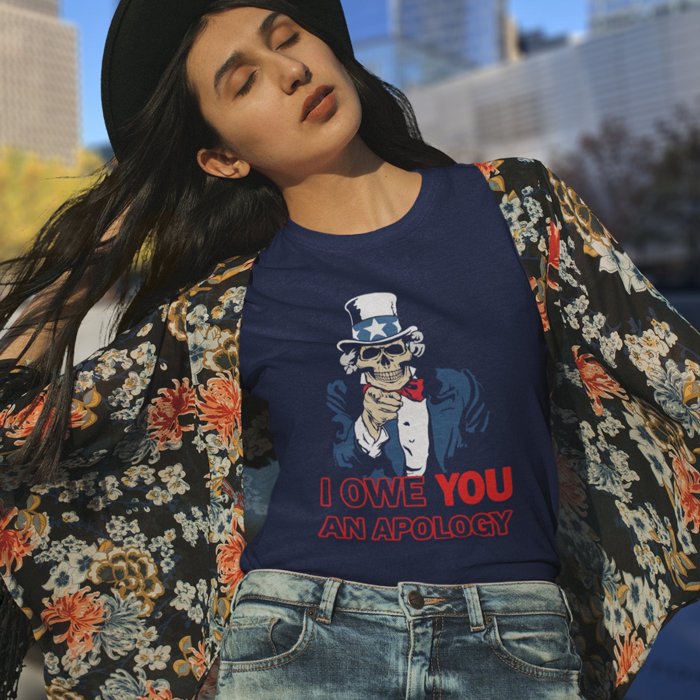 Person wearing a navy blue sweatshirt with a graphic design and text, standing outdoors. An anti government t shirt design of Uncle Sam. For too long dark deeds have been done in the name of good people. The government should always answer to the people. Made from 100% organic ring-spun cotton, this non conformist t shirt is unisex, high-quality, super comfy, and best of all, eco-friendly.y.