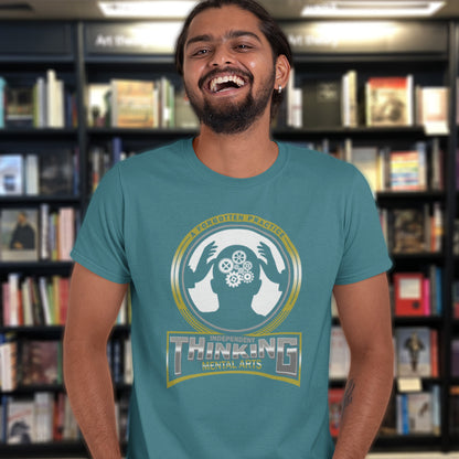 Man wearing a teal t-shirt with a graphic design in a bookstore. A satirical t-shirt suggesting independent thinking is a forgotten art since we let machines think for us. Promote independent thinking with this some what sarcastic t-shirt. Made from 100% organic ring-spun cotton, this satirical &amp; sarcastic t-shirt is unisex, high-quality, super comfy, and best of all, eco-friendly.