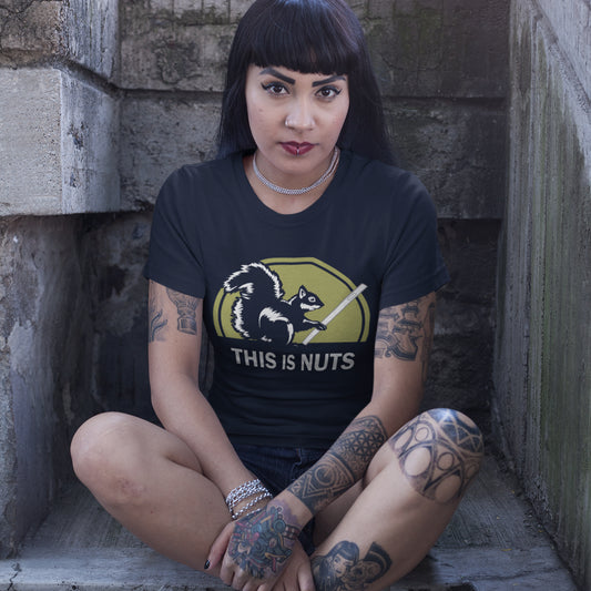 Person wearing a French navy t-shirt with a graphic design and text, sitting on stone steps. A funny mobile phone abuse t-shirt. Just about everyone is glued to a mobile phone these days. It's crazy. Increase social awareness of over use with this unique design. Made from 100% organic ring-spun cotton, this anti-mobile abuse t-shirt is unisex, high-quality, super comfy, and best of all, eco-friendly.