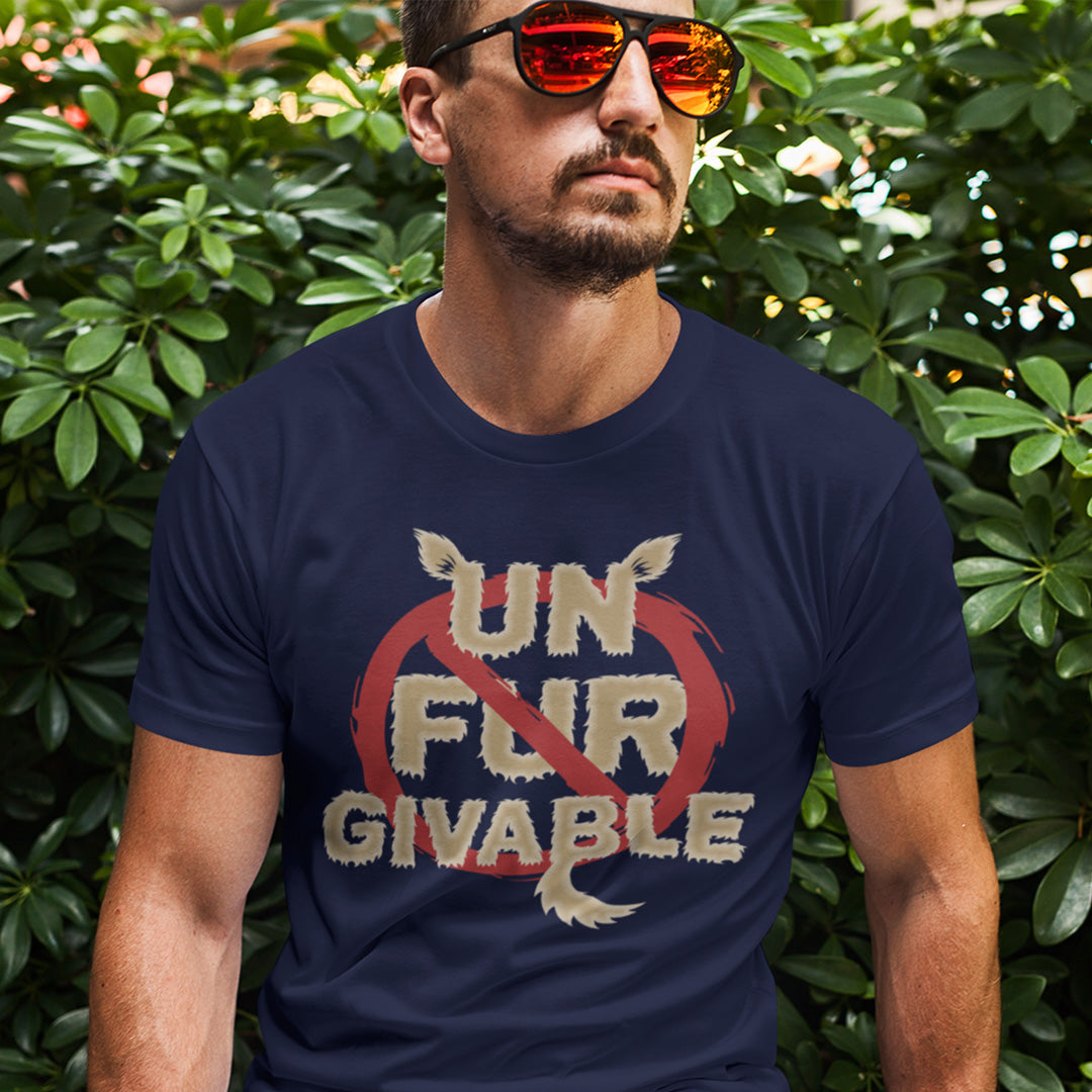 Man wearing a navy blue t-shirt with a graphic design in front of green foliage. This animal rights t shirt is anti fur and suggests the wearing of fur as unforgivable. Show your support against an unnecessary industry that promotes suffering and slaughter. Made from 100% organic ring-spun cotton, these animal activist t shirts are unisex, high-quality, super comfy, and best of all, eco-friendly.