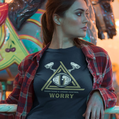 Woman wearing a t-shirt with a graphic design and text, standing in front of a colourful carousel. A conspiracy theory t-shirt for all that see paranoia as a necessity. This design is a must if your imagination is colourful enough to believe we are being controlled by reptilian alien overlords. Made from 100% organic ring-spun cotton, this alien conspiracy theory t-shirt is unisex, high-quality, super comfy, and best of all, eco-friendly.