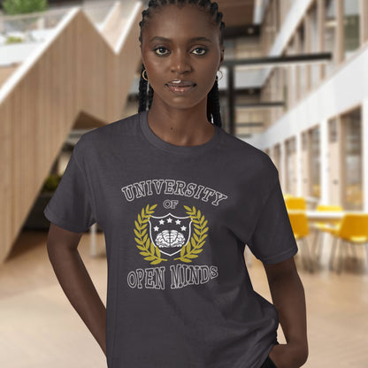 Person wearing a t-shirt with 'University of Open Minds' design in an indoor setting. A cool graphic design for the liberal minded. If you think outside the box then this university is for you. Only practical lessons and no student loan required. Made from 100% organic ring-spun cotton, this social awareness t-shirt is unisex, high-quality, super comfy, and best of all, eco-friendly.