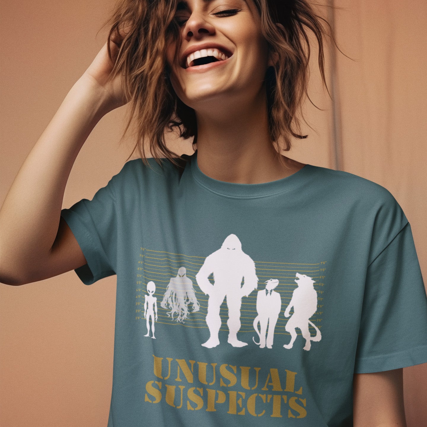 Person wearing a stargazer t-shirt with 'Unusual Suspects' graphic design on a beige background. A conspiracy theorist t shirt for movie lovers. From bigfoot to aliens, these are the personnel responsible for most cover ups and disputed existences. This imaginative stencil art design is for people who think outside the box. Made from 100% organic ring-spun cotton, this witty conspiracy theory t-shirt is unisex, high-quality, super comfy, and best of all, eco-friendly.