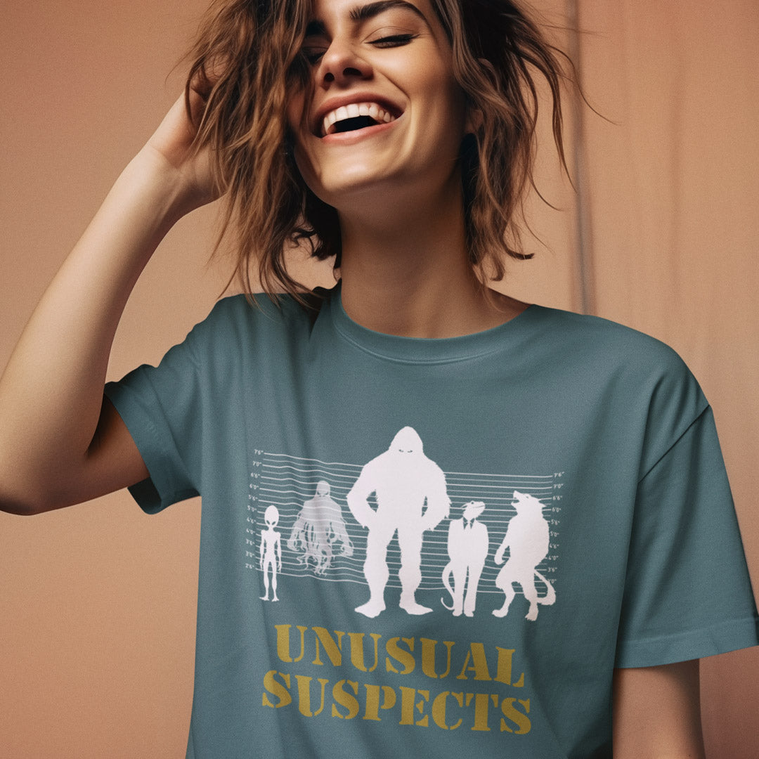 Woman laughing and wearing a stargazer t shirt with "UNUSUAL SUSPECTS" text.