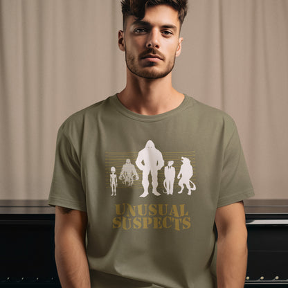 Man wearing a green t-shirt with 'Unusual Suspects' graphic design. A design for movie loving conspiracy theorists. From bigfoot to aliens, these are the personnel responsible for most cover ups and disputed existence. This imaginative stencil art is truly for people who think outside the box. Made from 100% organic ring-spun cotton, this witty conspiracy theory t-shirt is unisex, high-quality, super comfy, and best of all, eco-friendly.