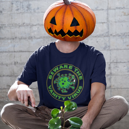 Person wearing a French navy blue t-shirt with a Halloween-themed design, sitting against a brick wall. This satirical counterculture t-shirt suggest there are some nasty viruses out there and vanity is one of the oldest. This unique t-shirt design promotes social awareness of the dangers of vanity because it's a bitch once it takes hold. Made from 100% organic ring-spun cotton, this witty counterculture t-shirt is unisex, high-quality, super comfy, and best of all, eco-friendly.