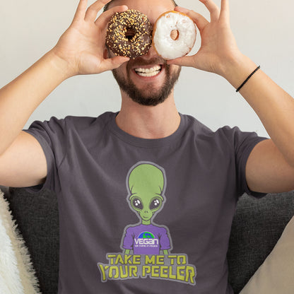Person wearing a t-shirt with an alien graphic and text, holding donuts over their eyes. A plant based t-shirt design for anyone that thinks aliens must be vegans, otherwise they would have been farming us years ago. This unique alien design is for all those conspiracy theorists out there. Made from 100% organic ring-spun cotton, this vegan t-shirt is unisex, high-quality, super comfy, and best of all, eco-friendly.
