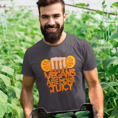 Man wearing a t-shirt with 'Vegans are more juicy' design in a garden setting. A plant based meat free t shirt design suggesting vegans drink more juices than most. Made from 100% organic ring-spun cotton, this vegan dairy free t shirt is unisex, high-quality, super comfy, and best of all, eco-friendly.