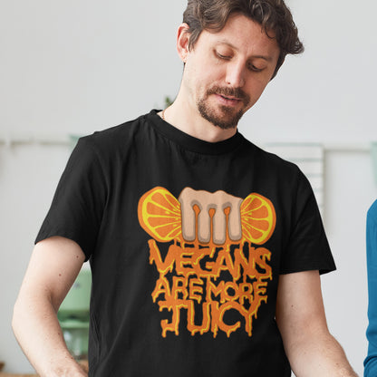 Person wearing a black t-shirt with a graphic design and text. A plant based meat free t shirt design suggesting vegans drink more juices than most. Made from 100% organic ring-spun cotton, this vegan dairy free t shirt is unisex, high-quality, super comfy, and best of all, eco-friendly.