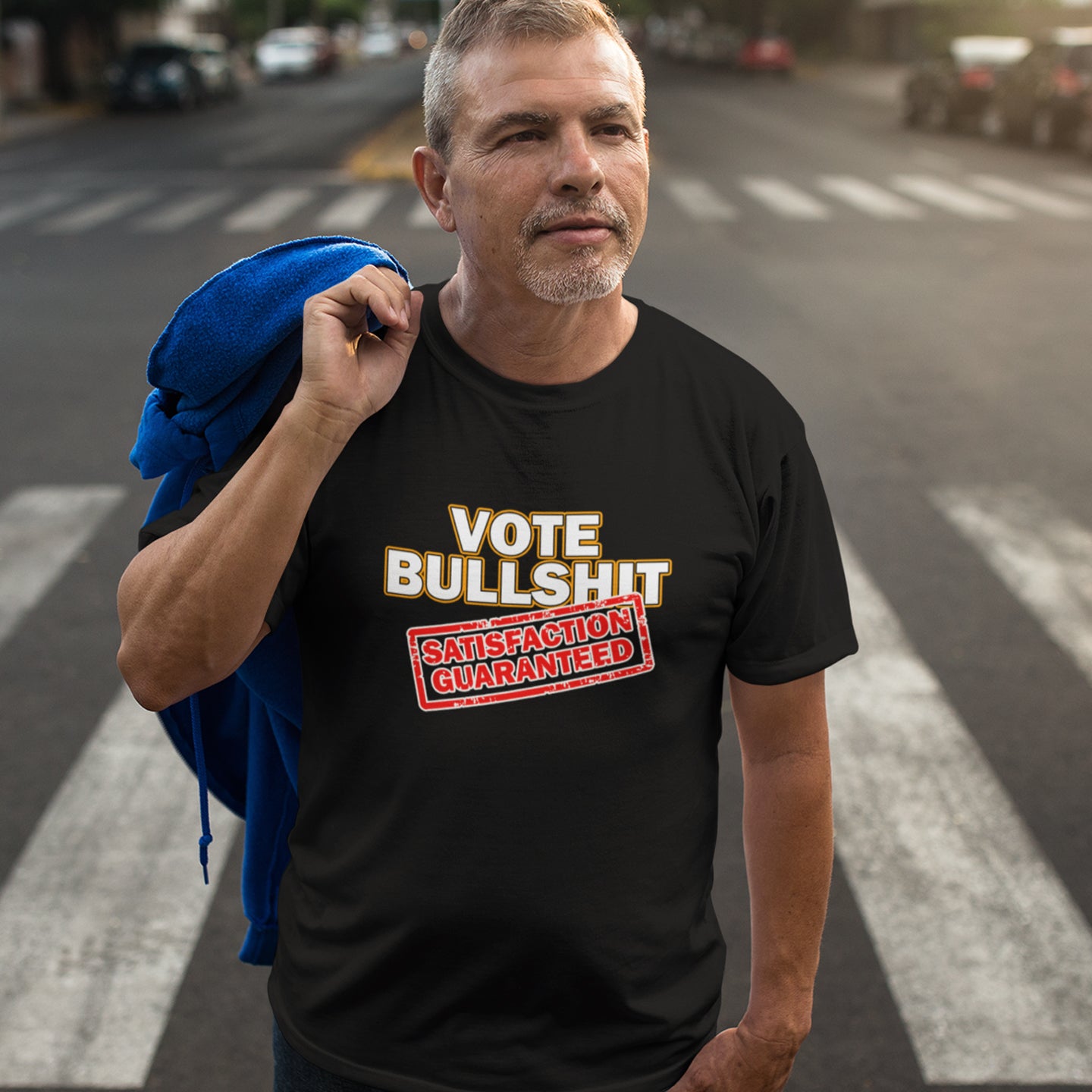 Man wearing a black t-shirt with a humorous political message on a street. This political t-shirt design tells it like it is. This unique anti-establishment t-shirt is for those who have lost all faith in politics. It seems no matter what you vote for, you definitely get bullshit. Made from 100% organic ring-spun cotton, this anti-government t-shirt is unisex, high-quality, super comfy, and best of all, eco-friendly.