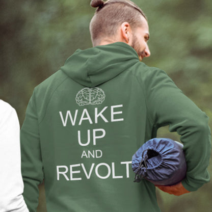 Person wearing a bottle green hoodie with 'Wake Up and Revolt' text on the back, standing outdoors. This satirical 'stay calm' hoodie suggests we have been calm too long and need of waking up and fighting for our right instead. Keeping calm got us into this mess, it's time to wake up. Comfortable and practical. It's extra soft and has a convenient front pouch pocket. Made from organic cotton and recycled polyester, this anti-establishment hoodie is a great eco-friendly choice.