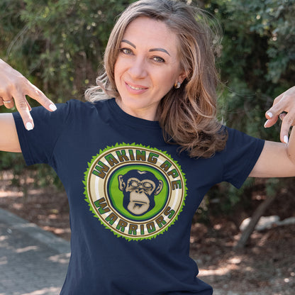 Woman wearing a French navy blue t-shirt with a graphic design of a monkey and text 'Waking Ape Warriors' outdoors. The message that comes with this original save the planet t shirt design is one of resistance to concrete jungles, processed food and plastic people. Ideal for anyone with environmental concern or any doubts about an A.I take over. Awaken your inner primate. Made from 100% organic ring-spun cotton, this save the Earth t shirt is unisex, high-quality, super comfy, and best of all, eco-friendly.