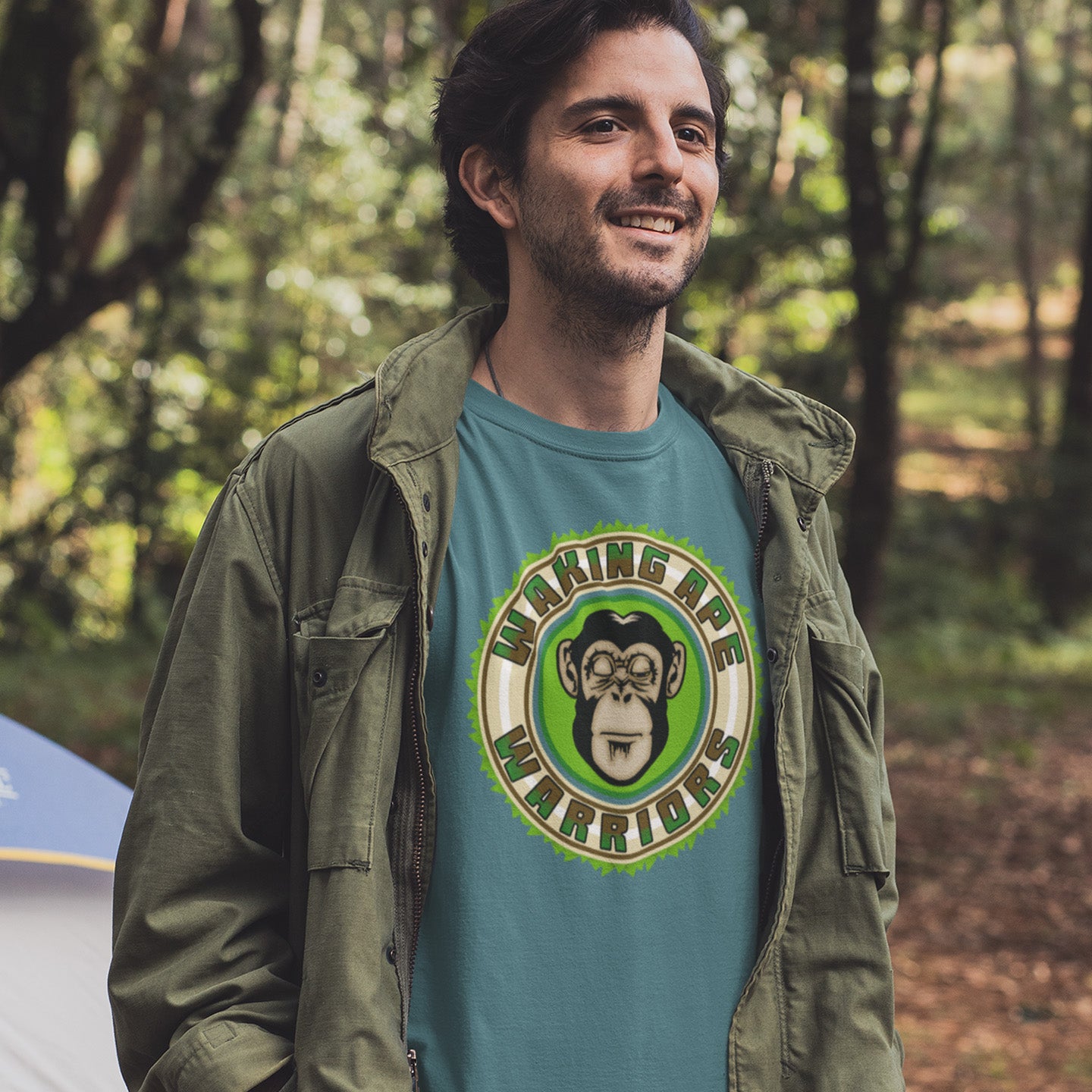 Man wearing a green jacket and a t-shirt with a monkey graphic and text in a forest setting. The message that comes with this original save the planet t shirt design is one of resistance to concrete jungles, processed food and plastic people. Ideal for anyone with environmental concern or any doubts about an A.I take over. Awaken your inner primate. Made from 100% organic ring-spun cotton, this save the Earth t shirt is unisex, high-quality, super comfy, and best of all, eco-friendly.