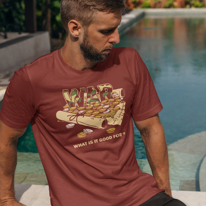 Man wearing a red t-shirt with a graphic design sitting by a pool. A satirical anti-war t-shirt suggesting we know what it's good for, money and land deeds for starters. Expose the big business of War with this unique design made for any anti-war demonstration. Made from 100% organic ring-spun cotton, this political t-shirt is unisex, high-quality, super comfy, and best of all, eco-friendly.