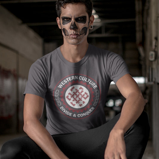 Person wearing an anthracite t-shirt with a graphic design and skull makeup sitting in an industrial setting. This counter culture t shirt questions the politics of western society. Let's drop the façade that western culture is more civilised and advanced. This design highlights a method of people management that has worked for the Western elite for centuries. Made from 100% organic ring-spun cotton, this broken society t shirt is unisex, high-quality, super comfy, and best of all, eco-friendly.