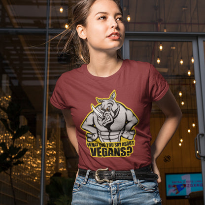 A woman walking out of a bar, wearing a burgundy short sleeved crew neck t-shirt with a cartoon Rhino design and the caption "WHAT DID YOU SAY ABOUT VEGANS?".