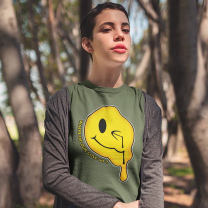 Person wearing a khaki shirt with a yellow smiley face design outdoors. A old skool acid house t-shirt. This design is a tribute to 90's house music and the love that was felt around the scene. What happened ? Made from 100% organic ring-spun cotton, this acid house t-shirt is unisex, high-quality, super comfy, and best of all, eco-friendly.