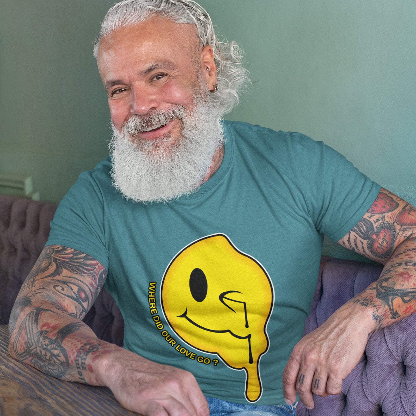 Man with tattoos wearing a stargazer t-shirt with a yellow graphic design. A old skool acid house t-shirt. This design is a tribute to 90's house music and the love that was felt around the scene. What happened ? Made from 100% organic ring-spun cotton, this acid house t-shirt is unisex, high-quality, super comfy, and best of all, eco-friendly.