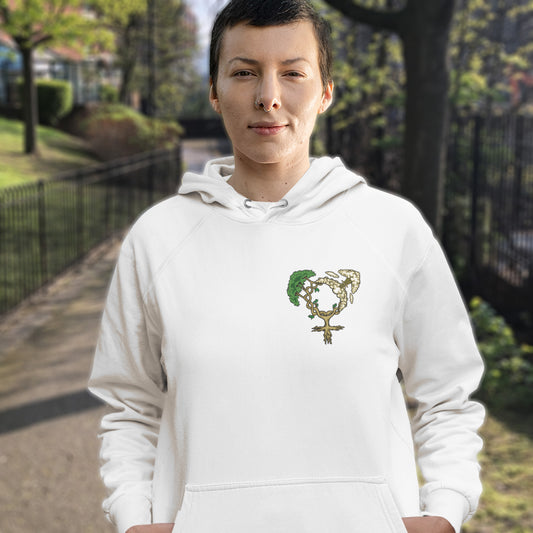 Person wearing a white hoodie with a tree design outdoors. A women's rights hoodie design that pays homage to women and promotes social awareness of how most destructive elements of humankind come from men. Women create life, men destroy it. Comfortable and practical. It's extra soft and has a convenient front pouch pocket. Made from organic cotton and recycled polyester, this women's rights hoodie is a great eco-friendly choice.